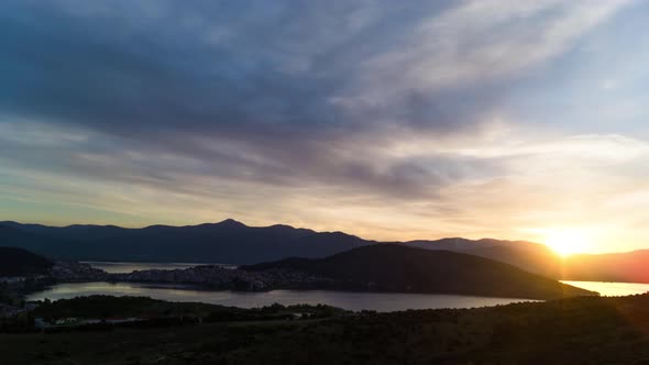 Time Lapse of sunsrise over mountanus city surounded by mountains with frame sampling