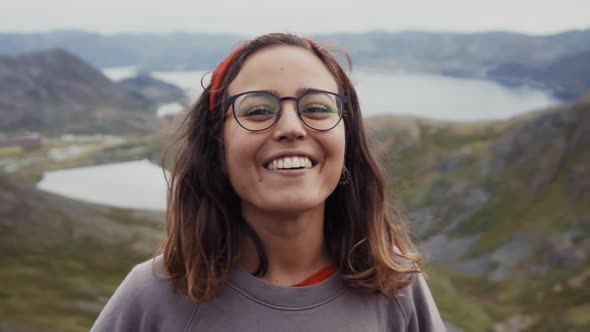 Cheerful laughing brunette in nature