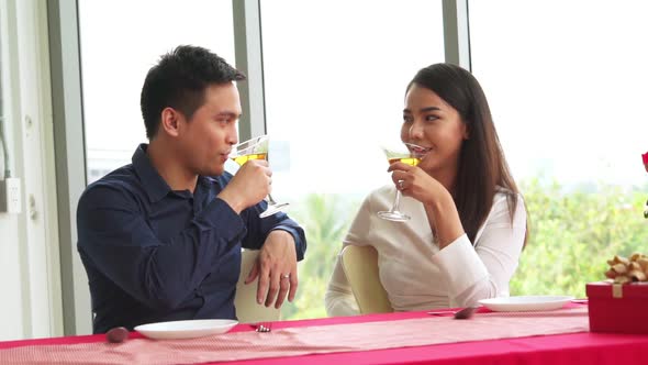 Happy Romantic Couple Eating Lunch at Restaurant