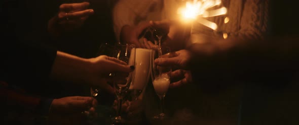 Close up of a man pouring sparkling wine in the glasses