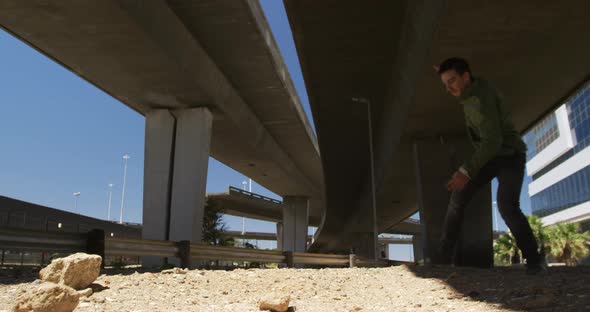 Caucasian man practicing parkour