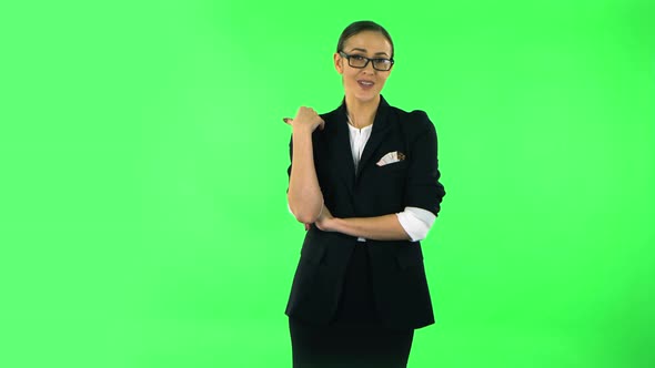 Beautiful Girl Is Reporting and Tells a Lot of Interesting Informations. Green Screen