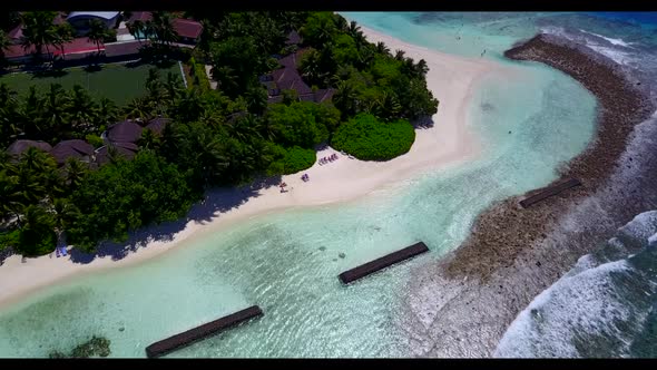 Aerial flying over scenery of tropical lagoon beach trip by blue water and white sand background of 