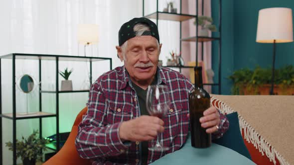 Smiling Elderly Grandfather Man Drinking Red Wine Glass Celebrating Birthday Anniversary Lottery Win