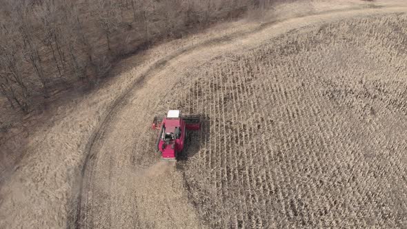 Aerial View Harvester Working on Corn Field. Autumn Agricultural Harvesting Work.