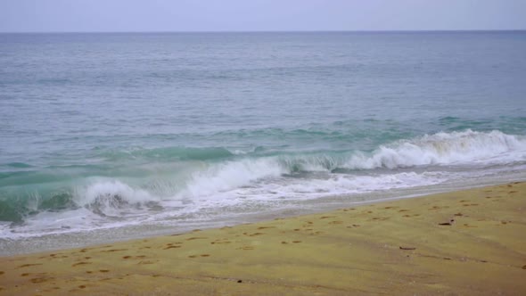 Powerful Wave Breaks Along the Shore