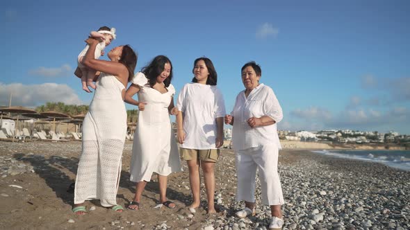 Wide Shot Portrait of Carefree Cheerful Asian Women of Different Ages Dancing Singing Standing on