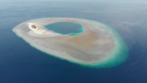 Aerial: Flying over idyllic atoll, Wakatobi Marine National Park Indonesia