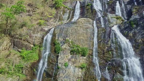 Different Powerful Waterfall Streams Fall Down Rocks