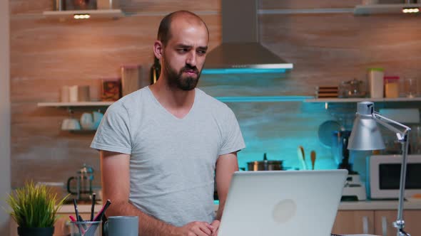 Man Discussing on Video Call Working From Home