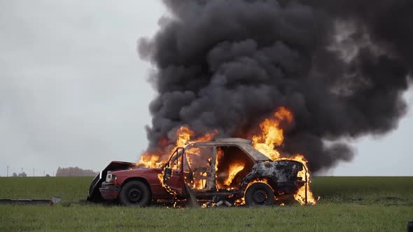 Car On Fire, Burning Car On The Field, Side View