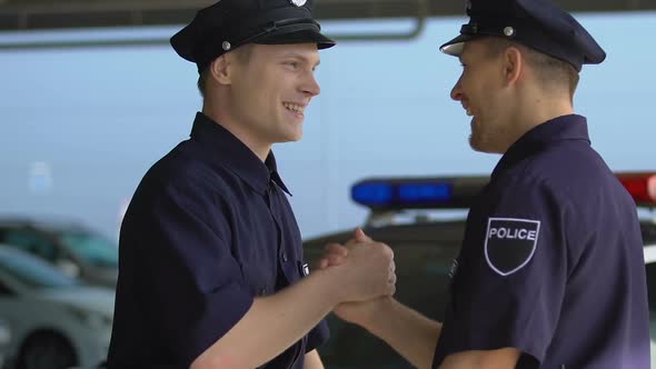 Male Police Companions Greeting Each Other Before Start of Shift, Friendship