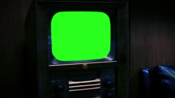 Vintage TV Set Green Screen in the Night. Zoom Out.