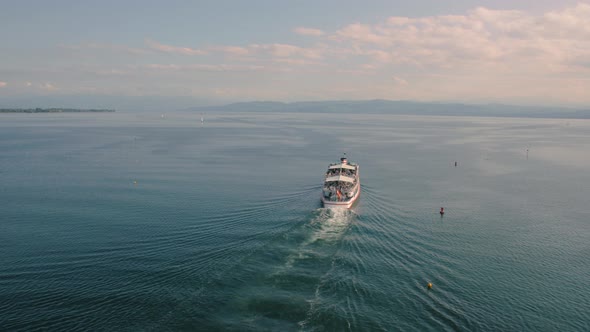 Boat With Tourists Sailing On Lake