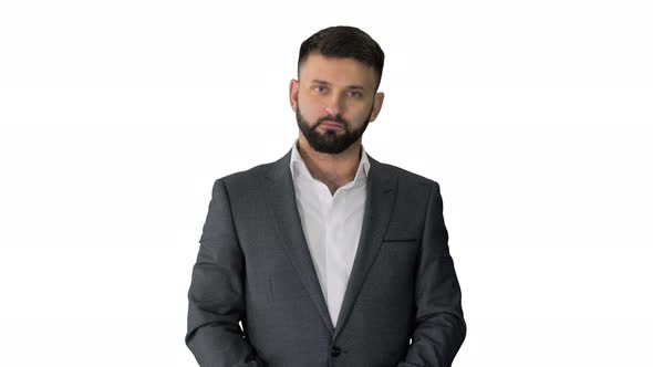 Man Looking at Camera and Applauding on White Background.