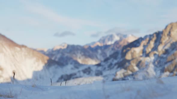 Man Running at the Mountain with Snow