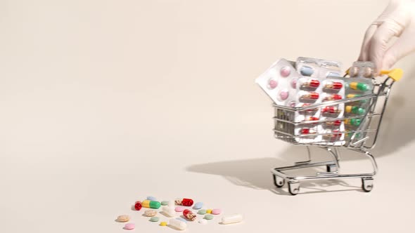 Closeup of Different Medical Pills in the Basket on Beige Background