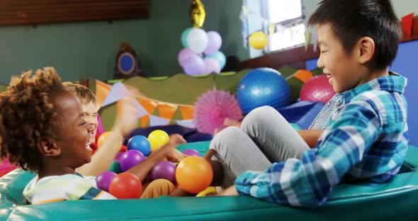 Kids playing together in ball pool 4k