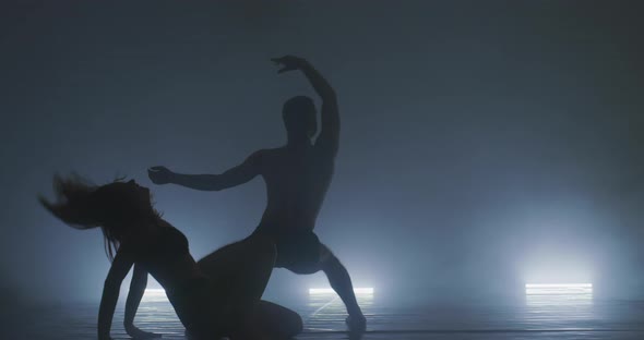 Silhouette of Group Dancers of Contemporary Ballet Ow Key