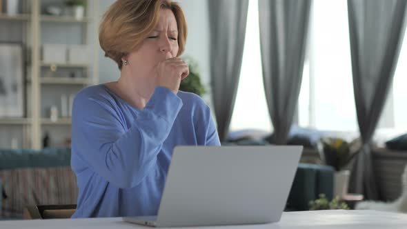 Sick Old Senior Woman Coughing at Work