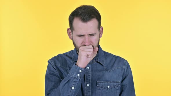 Sick Beard Young Man Coughing , Yellow Background