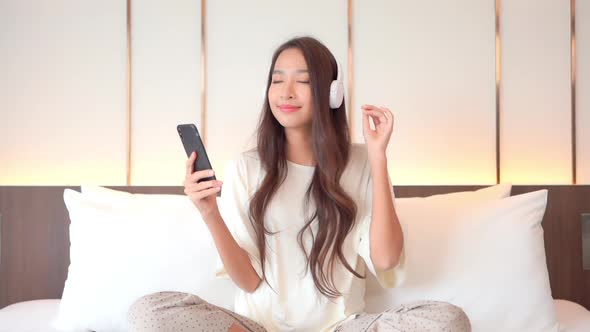 Woman use smart phone for listen music