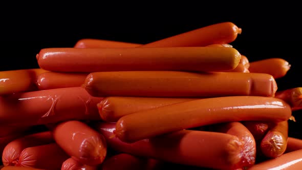 Close Up of Lot of Sausages on Dark Background