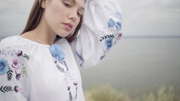 Beautiful Carefree Barefoot Girl Wearing Long Summer Fashion Dress Looking Confident at Camera