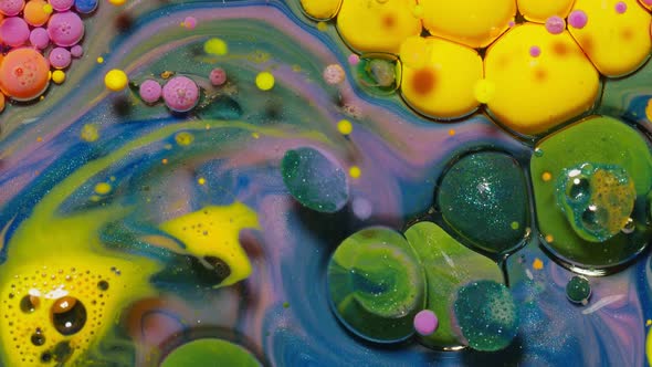 Yellow Neon Colorful Bubbles Oil and Ink Acrylic Paint Moving Closeup Wallpaper Background