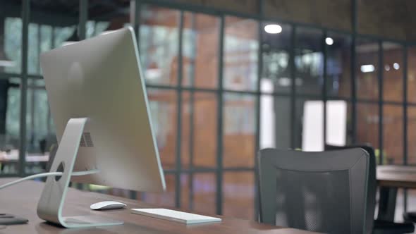 Young Man Join the Desk and Start Working on Computer