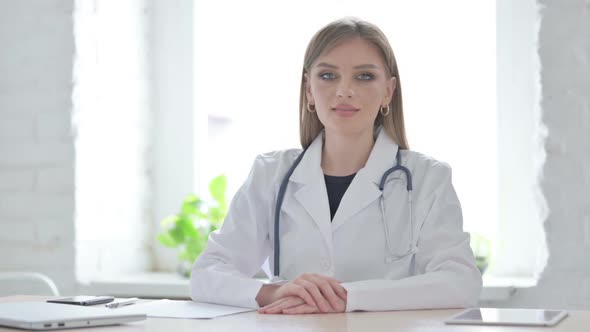 Lady Doctor Shaking Head in Acceptance in Clinic