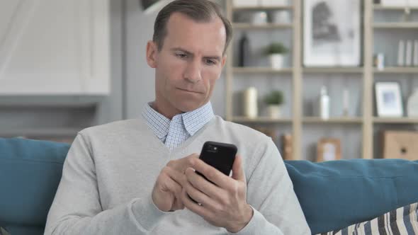 Relax Middle Aged Man Discussing on Phone Call