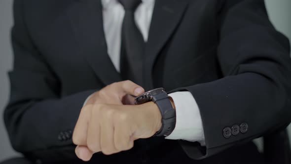 close up hand of business man using smart watch