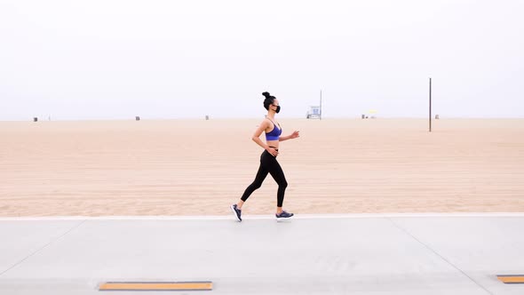 Athletic Asian woman going for her morning workout