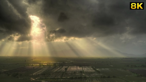 Real Sunbeams Landscape on Vast Plain at Sunset