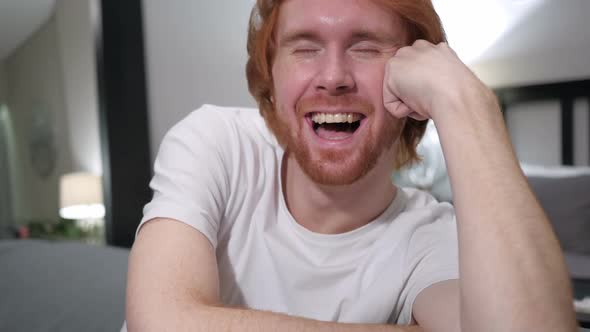Close Up of Laughing Excited Casual Redhead Man