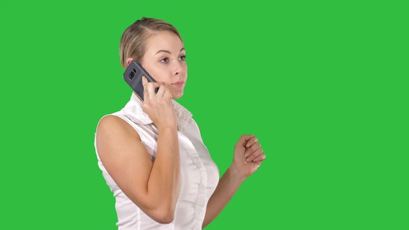 Charming business woman calling with cell telephone while