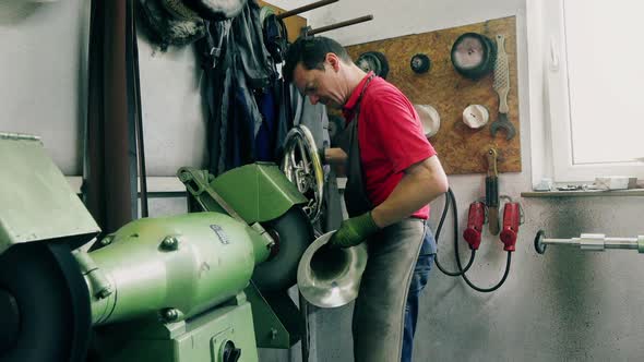 Craftsman polishing trumpet