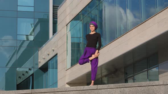 Strong Flexible Young Girl Yogi Muslim Islamic Woman Stands Background of City Building Doing Yoga