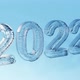 2022 Happy New Year date frosted ice snow glass rotation logo Cristmas Holiday background 3D render - VideoHive Item for Sale