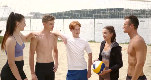 Group of Volleyball Players Standing at the Beach