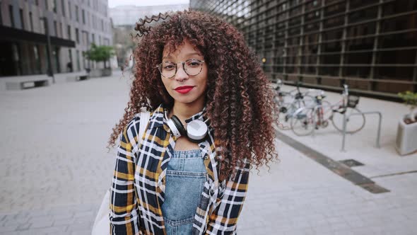 Close Up Portrait of Young African American Girl in Wireless Headphones