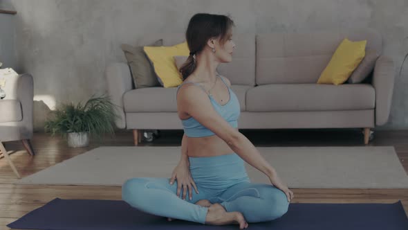 Beautiful Woman Doing Yofa At Home In Sunlight