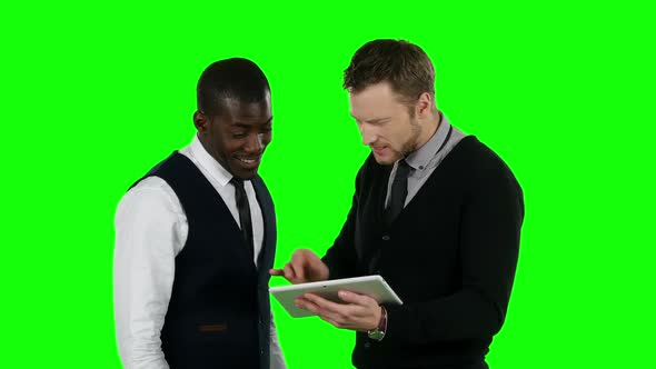 Business People Looking for Laptop and Very Happy. Green Screen