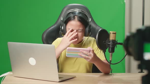 Asian Kid Girl Playing Video Game With Phone Then Lose The Game While Live Stream On Green Screen