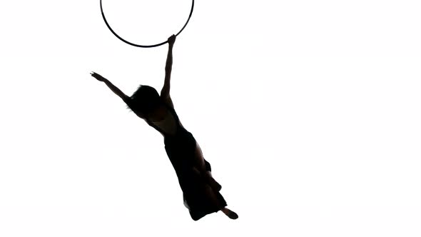 Aerial Acrobat Woman on Circus Stage. Silhouette on a White Background.