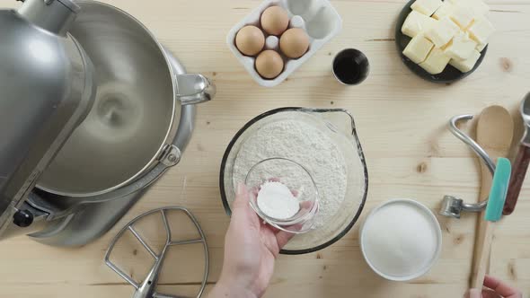 Step by step. Mixing fry ingredients together in glass bowl. Preparing sugar cookie dough for holida