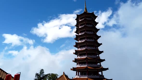 Time lapse Chin Swee Pagoda Buddhist Temple in Genting Highland, Malaysia with clear blue sky