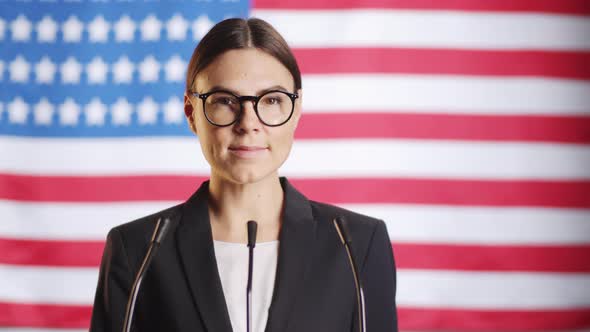 Portrait of Female Politician Posing on American Flag