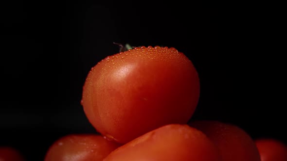 Ripe Fresh Red Tomatoes in Artificial Light Close Up